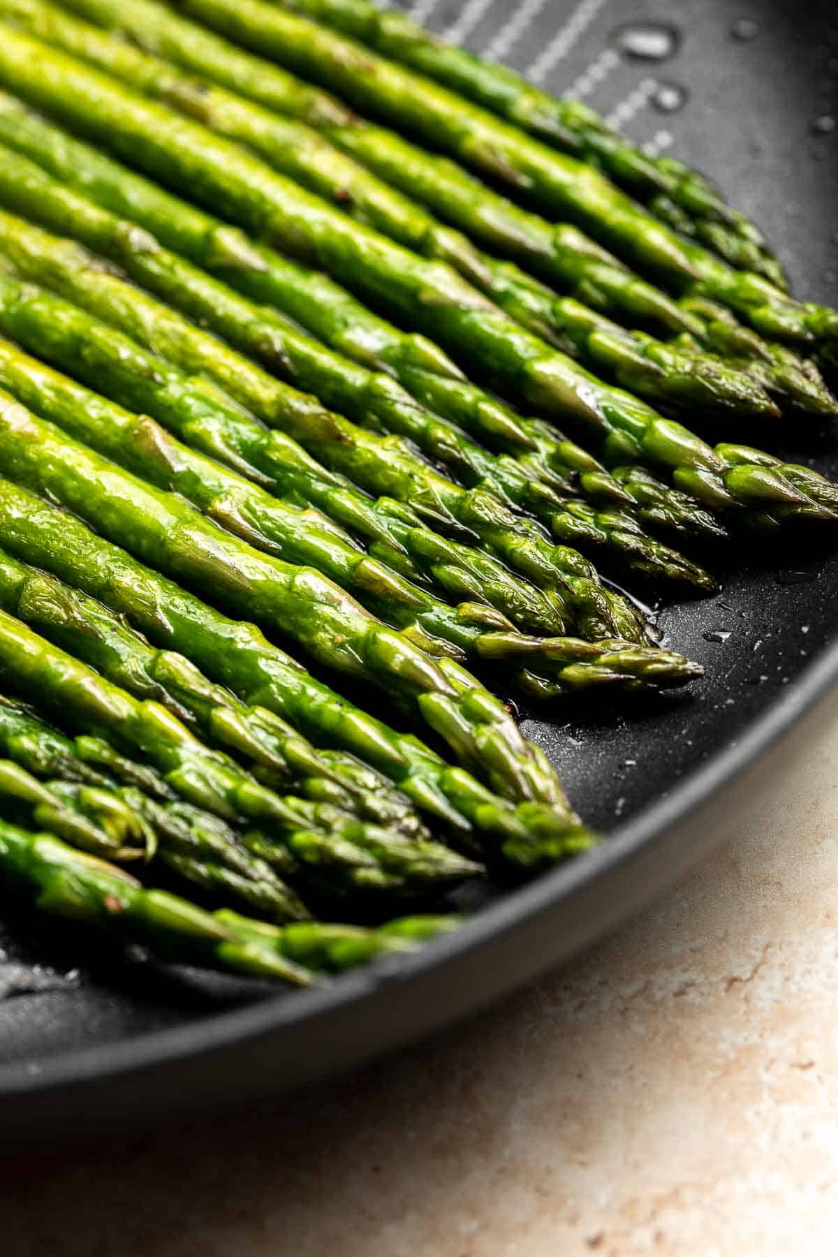 Quick and easy Sautéed Asparagus is a simple, savory side dish that goes well with almost any main dish. It's healthy, flavourful, and seasoned simply. | aheadofthyme.com