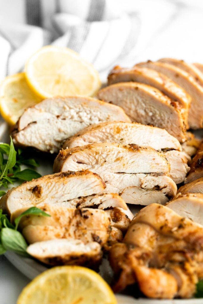 Juicy, tender, and moist, baked chicken breast with the best Greek souvlaki marinade is the most flavorful and delicious chicken dinner in under 30 minutes. | aheadofthyme.com