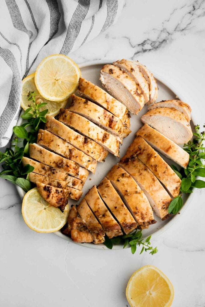 Juicy, tender, and moist, baked chicken breast with the best Greek souvlaki marinade is the most flavorful and delicious chicken dinner in under 30 minutes. | aheadofthyme.com