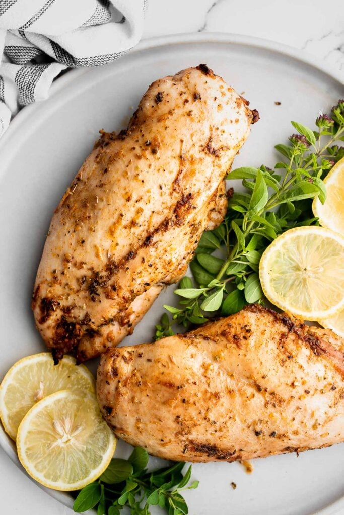 Juicy, tender, and moist, baked chicken breast with the best Greek souvlaki marinade is the most flavorful and delicious chicken dinner in under 30 minutes. | aheadofthyme.com