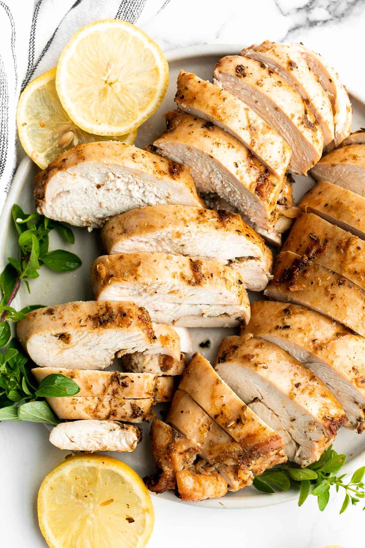 Juicy, tender, and moist, baked chicken breast with the best Greek souvlaki marinade is the most flavorful and delicious chicken dinner in under 30 minutes. | aheadofthyme.com