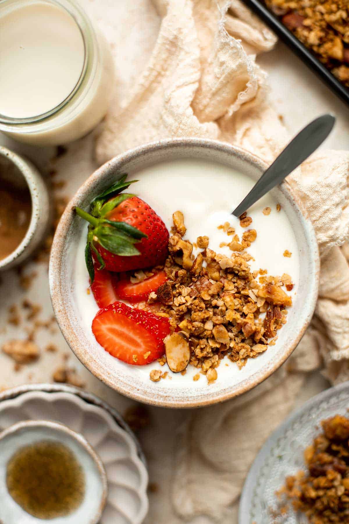 Coconut Maple Walnut Granola is easy to make from scratch with simple ingredients including 3 types of nuts. It's gluten-free, vegan and refined sugar-free! | aheadofthyme.com