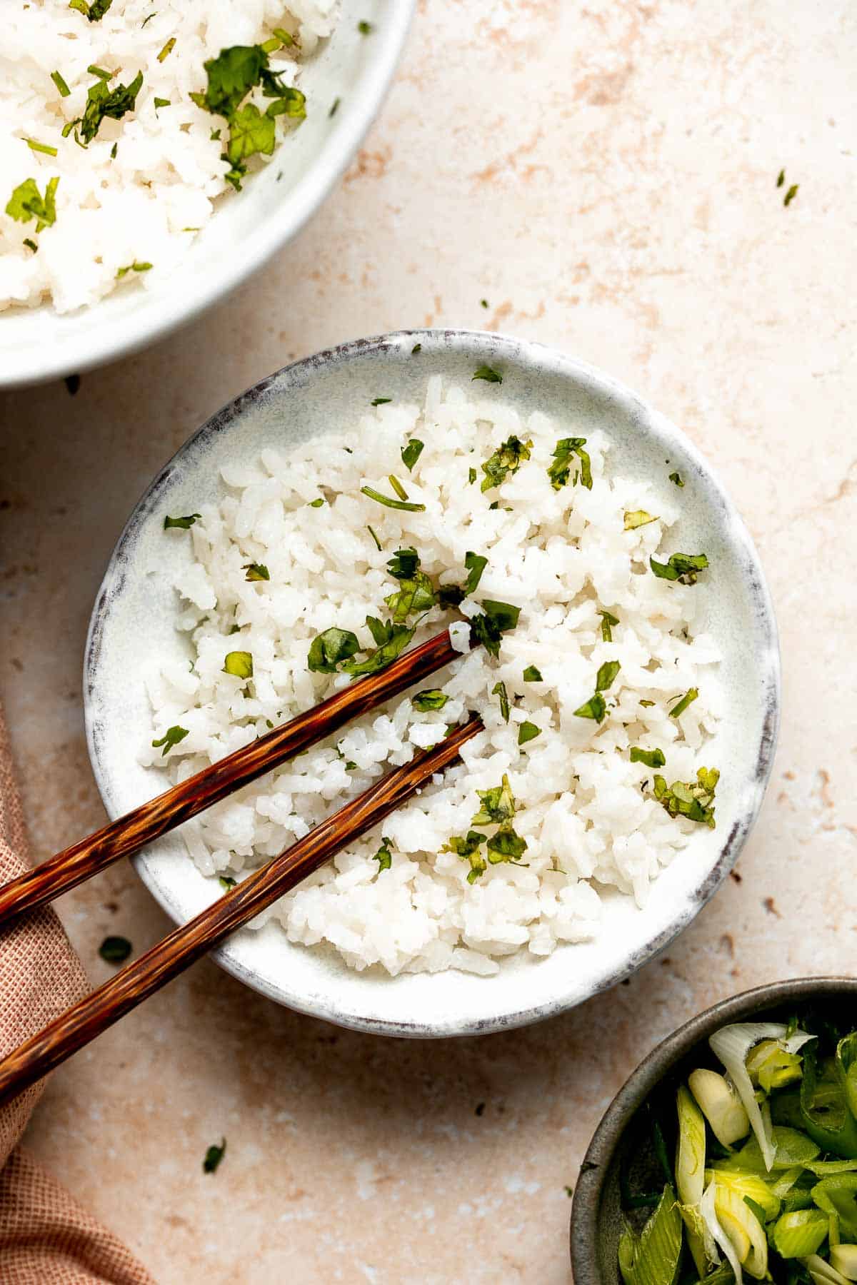 Easy coconut rice is light, fluffy, delicious, and flavorful. It's a quick and easy side dish that compliments all Thai, South Asian, and tropical dishes. | aheadofthyme.com