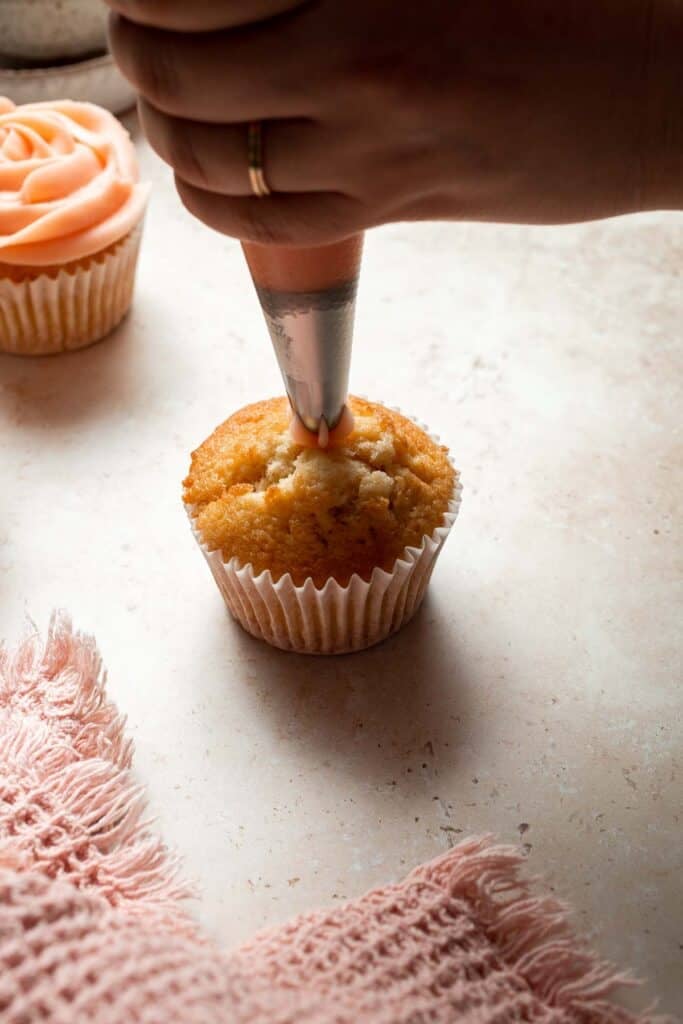 This Mother’s Day, treat someone special (or yourself!) to these beautifully light, airy, and fluffy Vanilla Cupcakes with Rose Petal Buttercream. | aheadofthyme.com