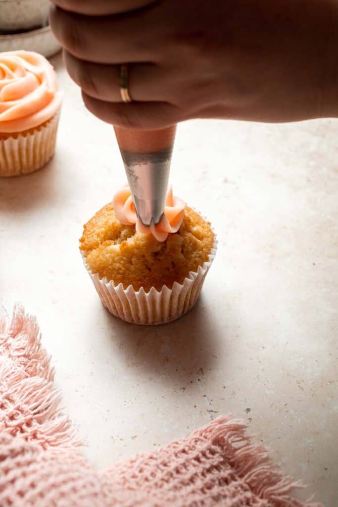 This Mother’s Day, treat someone special (or yourself!) to these beautifully light, airy, and fluffy Vanilla Cupcakes with Rose Petal Buttercream. | aheadofthyme.com