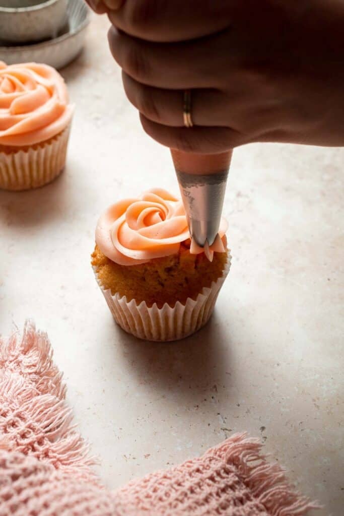 This Mother’s Day, treat someone special (or yourself!) to these beautifully light, airy, and fluffy Vanilla Cupcakes with Rose Petal Buttercream. | aheadofthyme.com