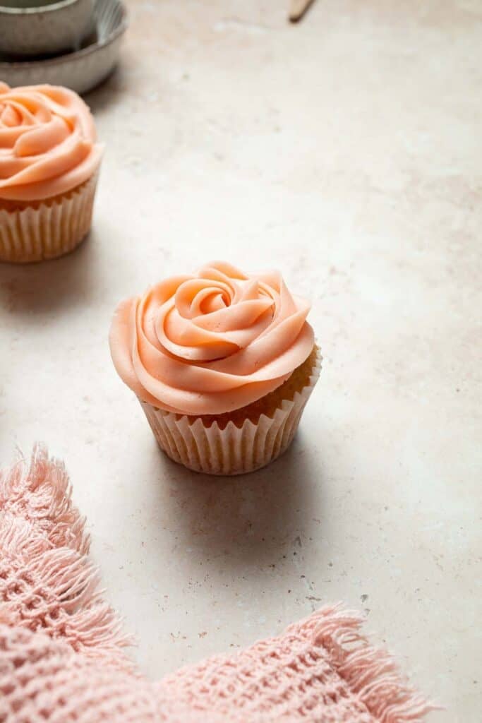 This Mother’s Day, treat someone special (or yourself!) to these beautifully light, airy, and fluffy Vanilla Cupcakes with Rose Petal Buttercream. | aheadofthyme.com