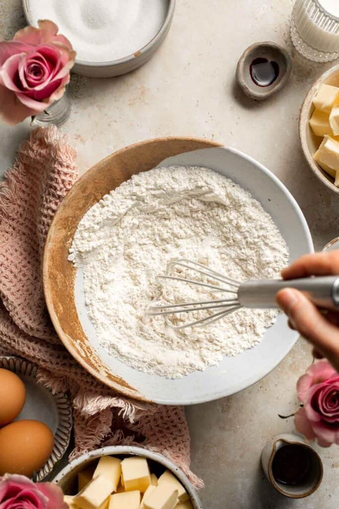 This Mother’s Day, treat someone special (or yourself!) to these beautifully light, airy, and fluffy Vanilla Cupcakes with Rose Petal Buttercream. | aheadofthyme.com