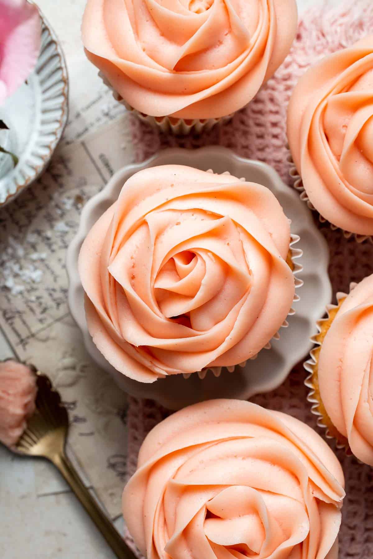 This Mother’s Day, treat someone special (or yourself!) to these beautifully light, airy, and fluffy Vanilla Cupcakes with Rose Petal Buttercream. | aheadofthyme.com