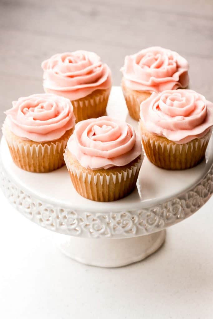 Light, airy and fluffy vanilla cupcakes with rose petal buttercream icing is the cutest treat for Mother’s Day. They are super quick and easy to make. | aheadofthyme.com