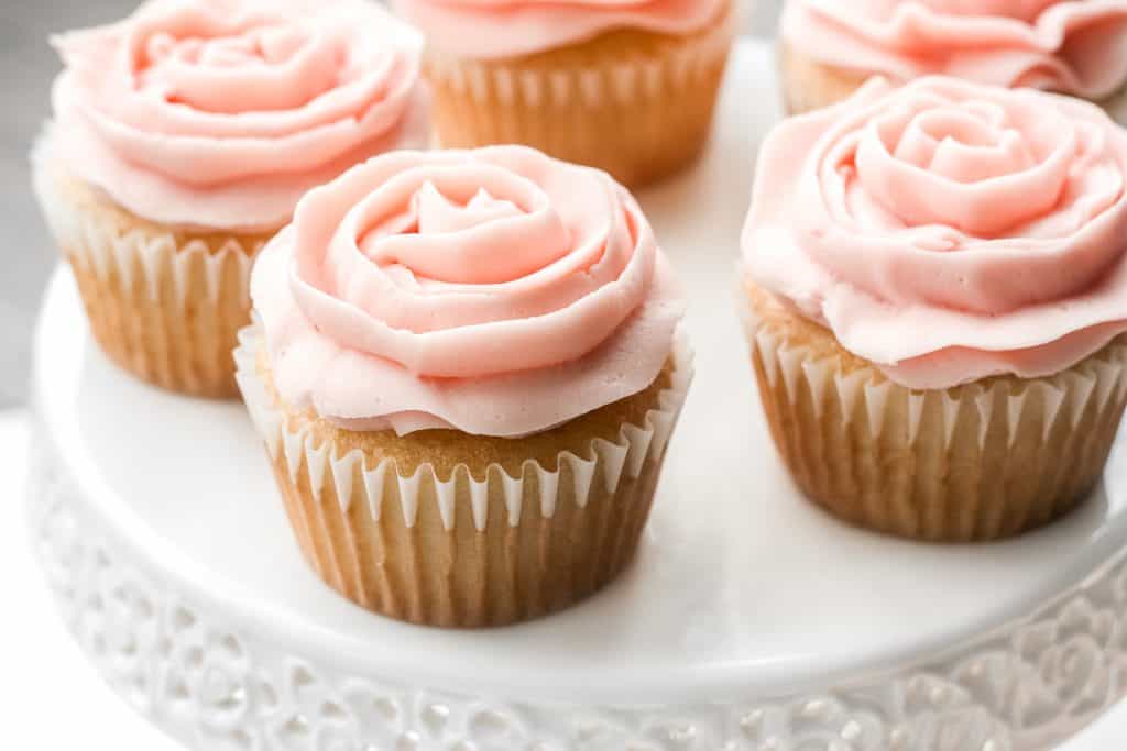 Light, airy and fluffy vanilla cupcakes with rose petal buttercream icing is the cutest treat for Mother’s Day. They are super quick and easy to make. | aheadofthyme.com