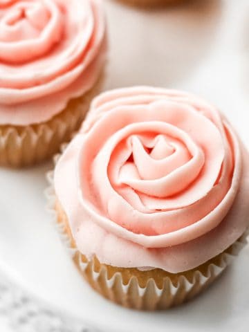 Light, airy and fluffy vanilla cupcakes with rose petal buttercream icing is the cutest treat for Mother’s Day. They are super quick and easy to make. | aheadofthyme.com