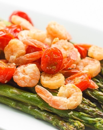 Light, fresh and vibrant, roasted lemon garlic shrimp and asparagus is the perfect dish for the spring and upcoming summer season | aheadofthyme.com
