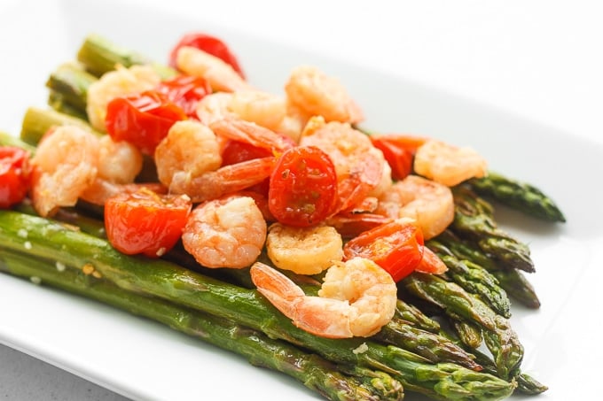 Light, fresh and vibrant, roasted lemon garlic shrimp and asparagus is the perfect dish for the spring and upcoming summer season | aheadofthyme.com