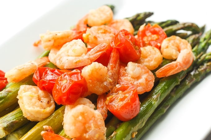 Light, fresh and vibrant, roasted lemon garlic shrimp and asparagus is the perfect dish for the spring and upcoming summer season | aheadofthyme.com