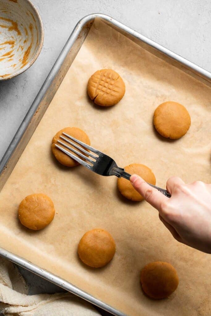 The BEST Soft and Chewy Peanut Butter Cookies are thick, puffy, and melt-in-your-mouth good. Easy to make in under 20 minutes — and they stay soft for days! | aheadofthyme.com