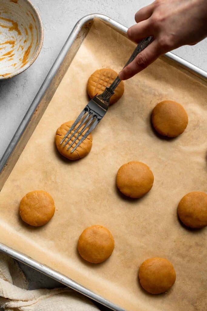 The BEST Soft and Chewy Peanut Butter Cookies are thick, puffy, and melt-in-your-mouth good. Easy to make in under 20 minutes — and they stay soft for days! | aheadofthyme.com