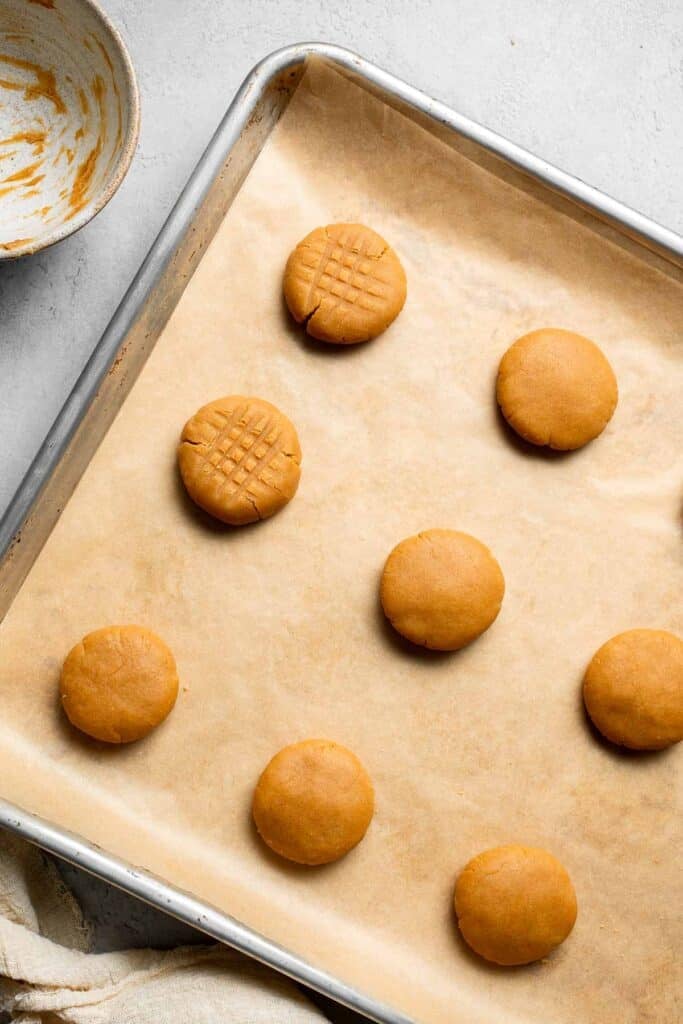 The BEST Soft and Chewy Peanut Butter Cookies are thick, puffy, and melt-in-your-mouth good. Easy to make in under 20 minutes — and they stay soft for days! | aheadofthyme.com