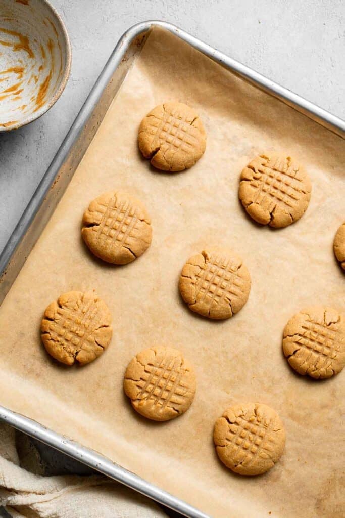 The BEST Soft and Chewy Peanut Butter Cookies are thick, puffy, and melt-in-your-mouth good. Easy to make in under 20 minutes — and they stay soft for days! | aheadofthyme.com
