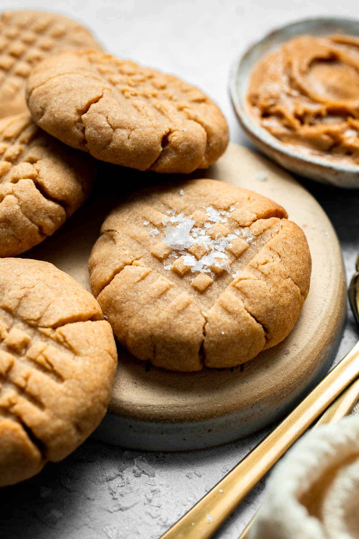 The BEST Soft and Chewy Peanut Butter Cookies are thick, puffy, and melt-in-your-mouth good. Easy to make in under 20 minutes — and they stay soft for days! | aheadofthyme.com