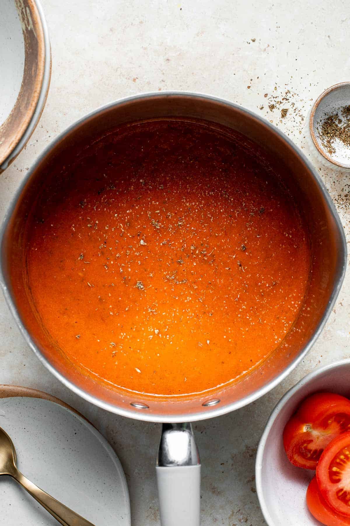 Roasted red pepper and tomato soup is silky smooth, incredibly flavorful and delicious, and easy to make. This vegan soup is healthy and nutritious too. | aheadofthyme.com