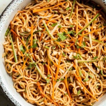 Flavorful, crispy, and crunchy, this Asian Cold Noodle Salad is made with noodles, vegetables, peanuts, and cilantro tossed in a homemade peanut dressing. | aheadofthyme.com