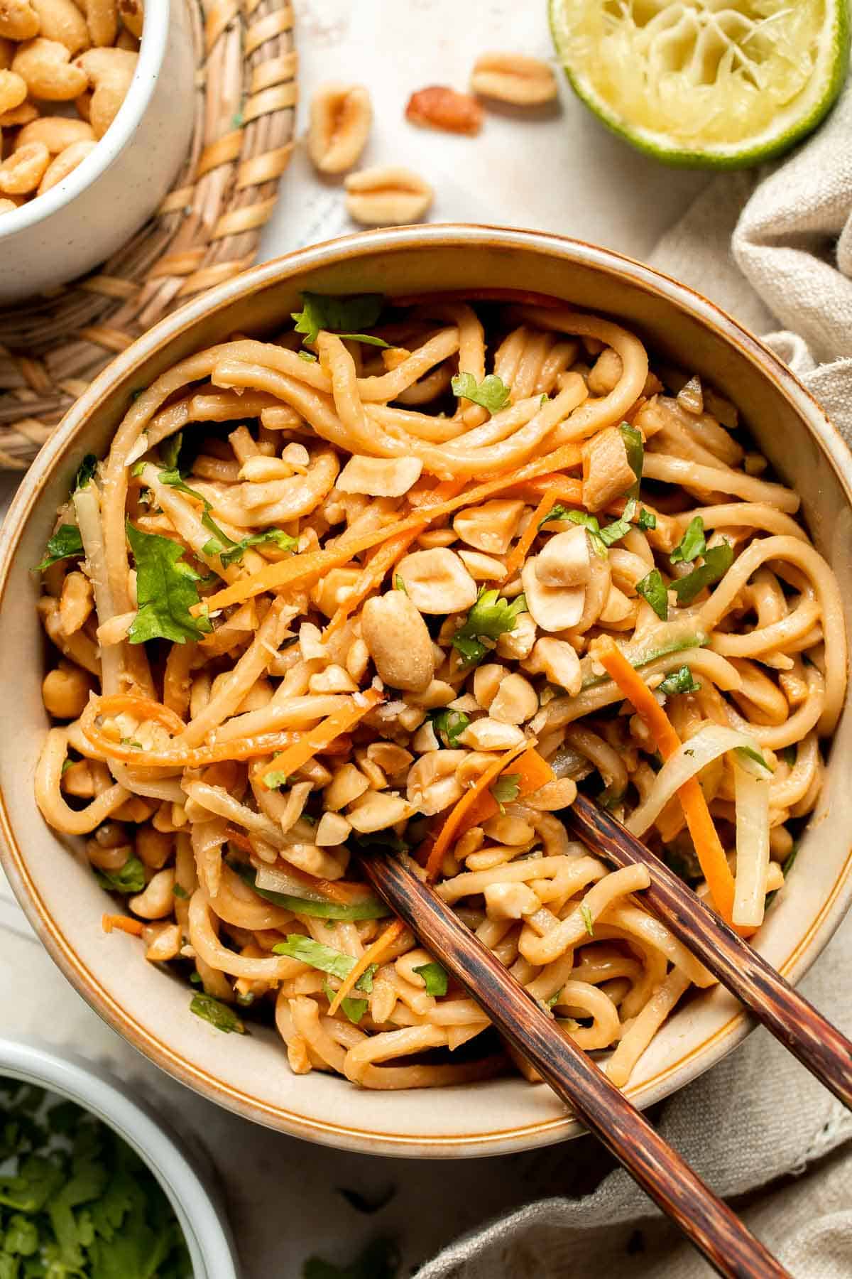 Flavorful, crispy, and crunchy, this Asian Cold Noodle Salad is made with noodles, vegetables, peanuts, and cilantro tossed in a homemade peanut dressing. | aheadofthyme.com