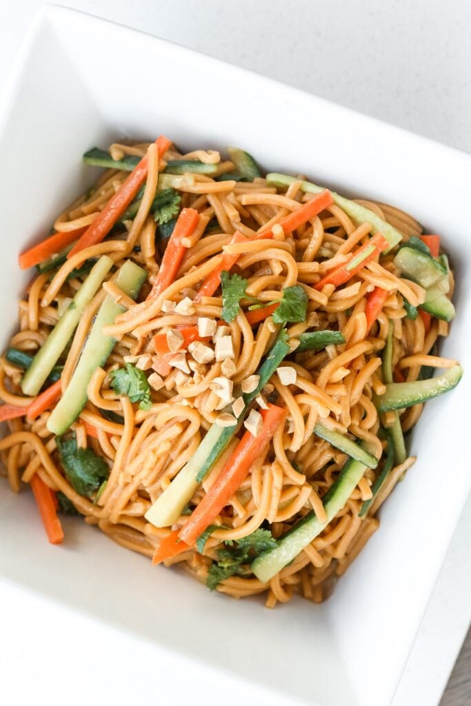 Nothing screams summer more than a crispy, crunchy, Asian cold noodle salad infused with a refreshing peanut, cilantro and lime dressing. | aheadofthyme.com