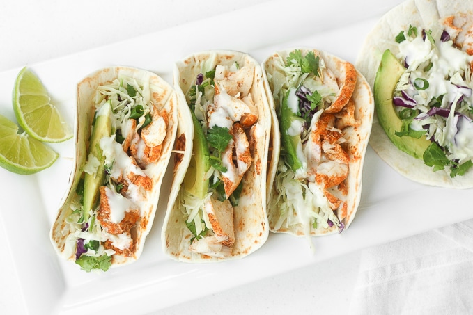 Easy Fish Tacos with Lime Crema: When lime and cilantro come together with fish, a mouthful of exquisite flavour is born. Try these easy fish tacos with lime crema and see for yourself! | aheadofthyme.com