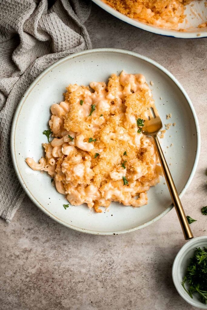 Classic baked mac and cheese is the ultimate comfort food — creamy, cheesy, and cozy, topped with a crunchy breadcrumb topping. It's quick and easy too. | aheadofthyme.com