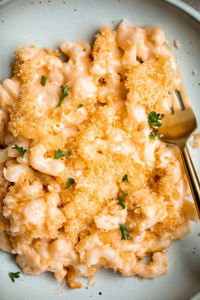 Classic baked mac and cheese is the ultimate comfort food — creamy, cheesy, and cozy, topped with a crunchy breadcrumb topping. It's quick and easy too. | aheadofthyme.com