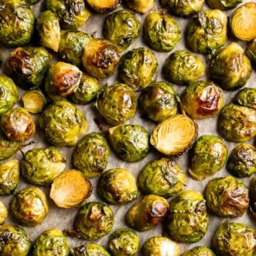 Tender and caramelized, these easy Roasted Brussels Sprouts tossed in balsamic vinegar and honey are a classic side dish to serve on your holiday table. | aheadofthyme.com