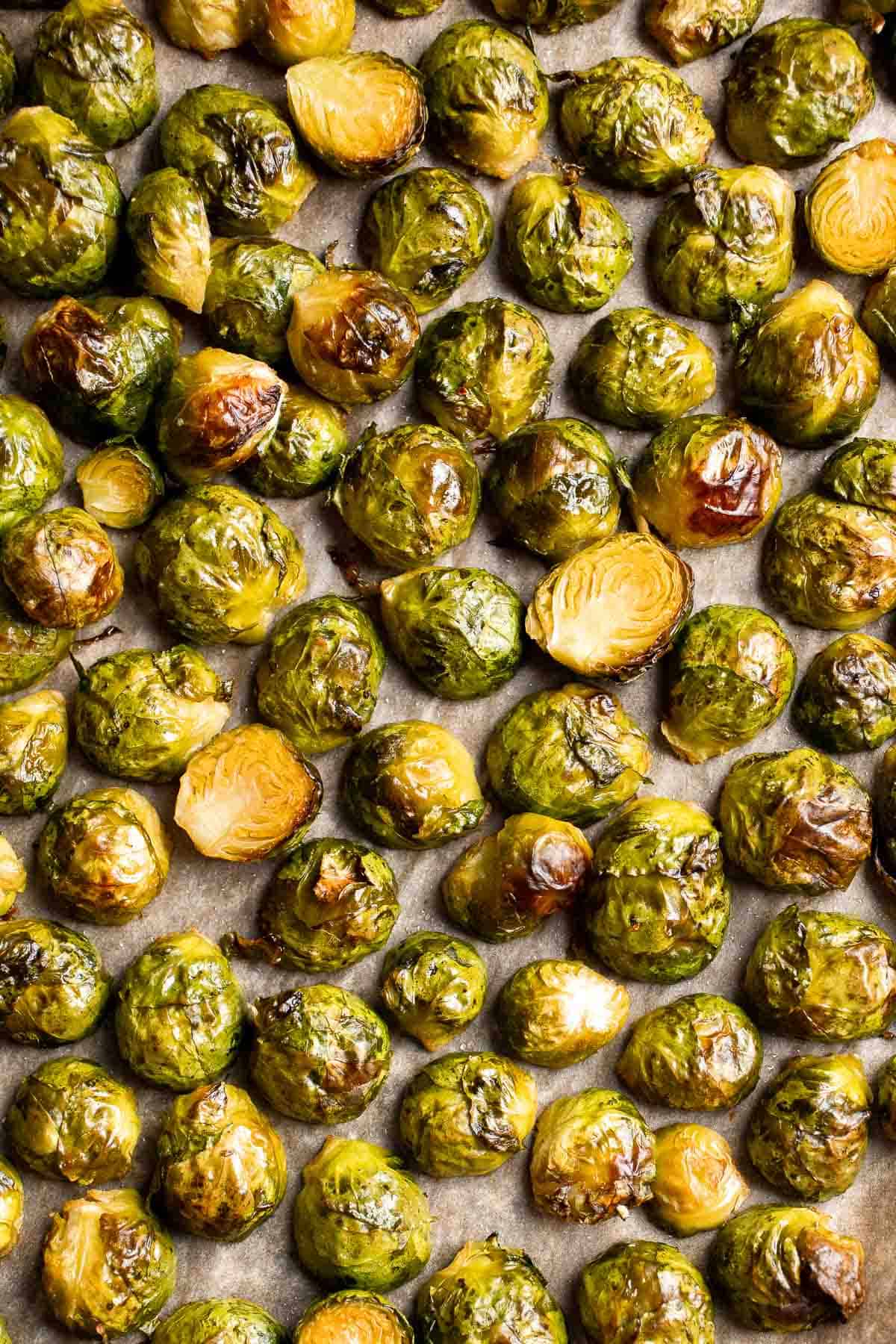 Tender and caramelized, these easy Roasted Brussels Sprouts tossed in balsamic vinegar and honey are a classic side dish to serve on your holiday table. | aheadofthyme.com