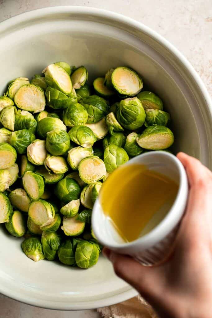 Tender and caramelized, these easy Roasted Brussels Sprouts tossed in balsamic vinegar and honey are a classic side dish to serve on your holiday table. | aheadofthyme.com
