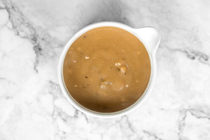 Thanksgiving is not the same without thick and delicious, classic homemade turkey gravy made using leftover drippings and homemade turkey stock. | aheadofthyme.com