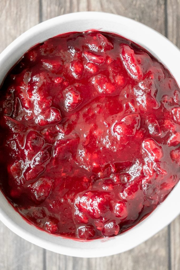 Take the stress out of the holidays and prepare easy make-ahead cranberry sauce days before Thanksgiving dinner in 15 minutes with just 3 ingredients. | aheadofthyme.com