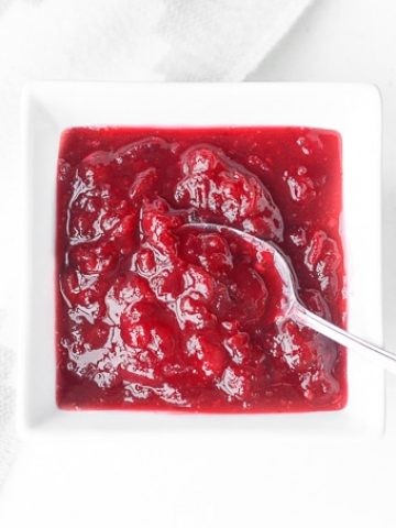 Take the stress out of the holidays and prepare easy make-ahead cranberry sauce days before Thanksgiving dinner in 15 minutes with just 3 ingredients. | aheadofthyme.com