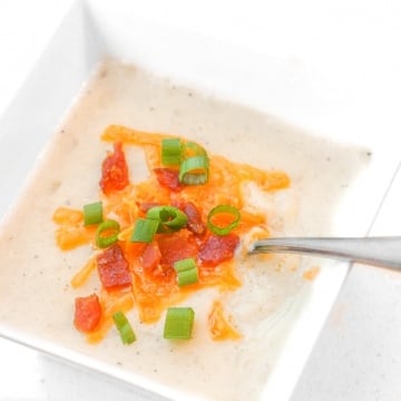 Slow Cooker Loaded Baked Potato Soup: Nothing says comfort food like a bowl of slow cooker loaded baked potato soup topped with cheddar cheese, crumbled bacon and green onions. | aheadofthyme.com