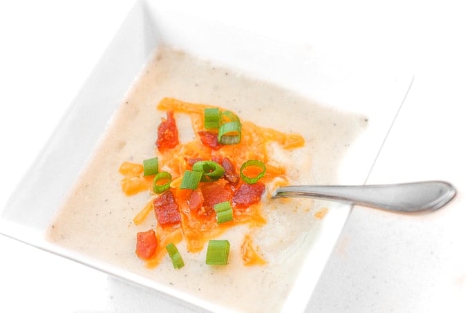 Slow Cooker Loaded Baked Potato Soup: Nothing says comfort food like a bowl of slow cooker loaded baked potato soup topped with cheddar cheese, crumbled bacon and green onions. | aheadofthyme.com