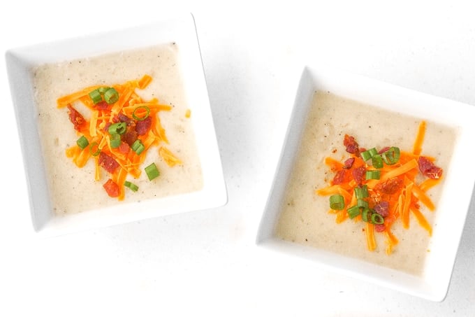 Slow Cooker Loaded Baked Potato Soup: Nothing says comfort food like a bowl of slow cooker loaded baked potato soup topped with cheddar cheese, crumbled bacon and green onions. | aheadofthyme.com