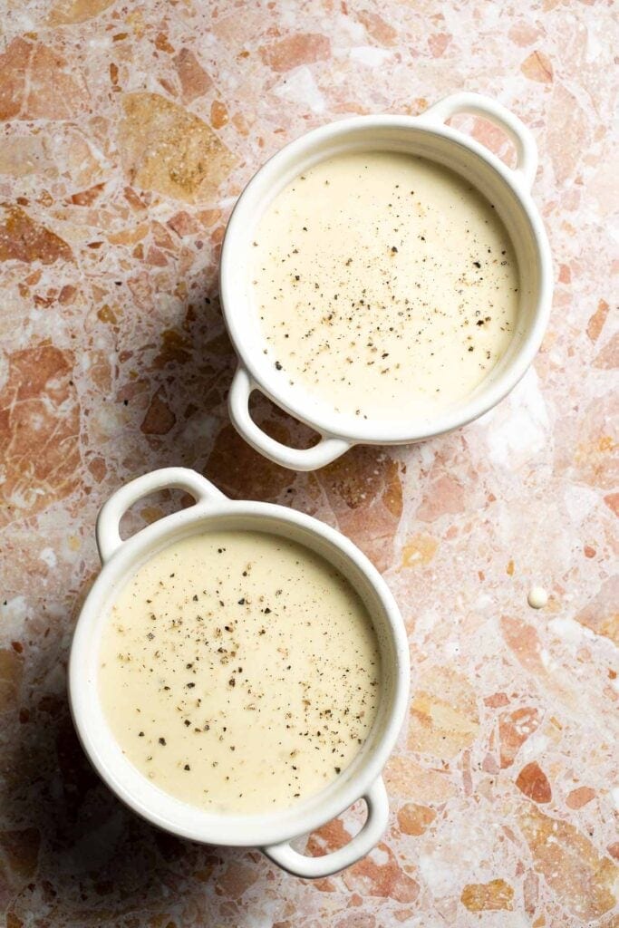 Creamy slow cooker loaded baked potato soup made with tender potatoes, cheddar cheese, sour cream, and topped with bacon. An easy comfort food recipe. | aheadofthyme.com
