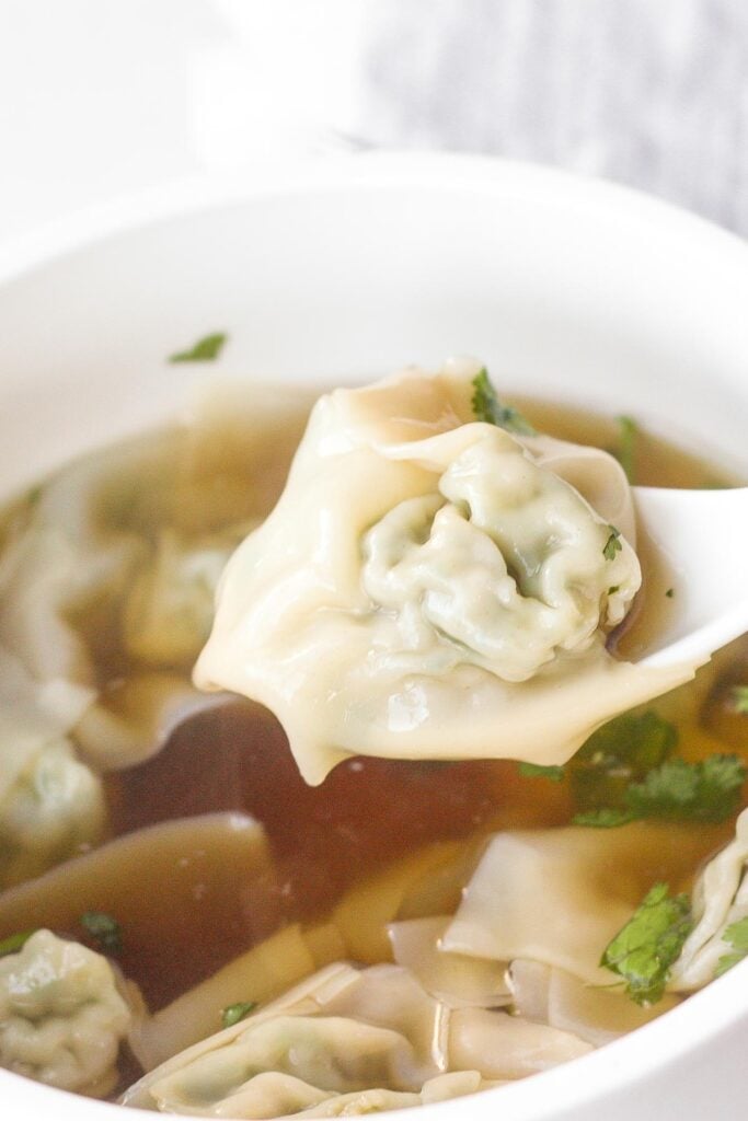 Learn how to make easy 10-minute wonton soup, using just a handful of delicious ingredients. | aheadofthyme.com