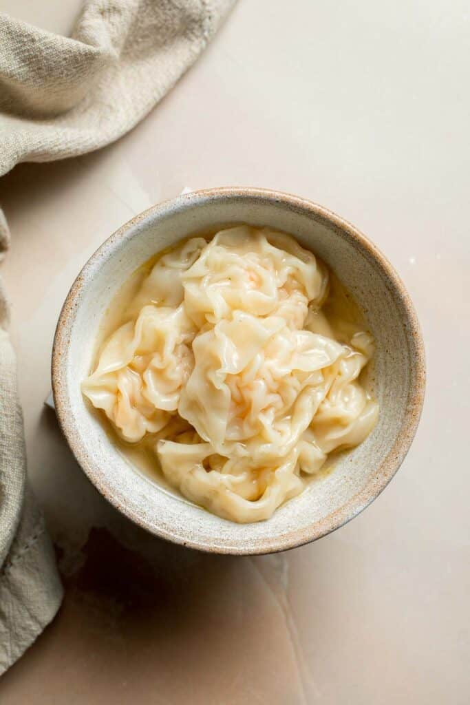 Easy 10-minute Wonton Soup is filling, delicious, and flavorful. With just a handful of simple ingredients, this homemade soup is ready in only 10 minutes! | aheadofthyme.com