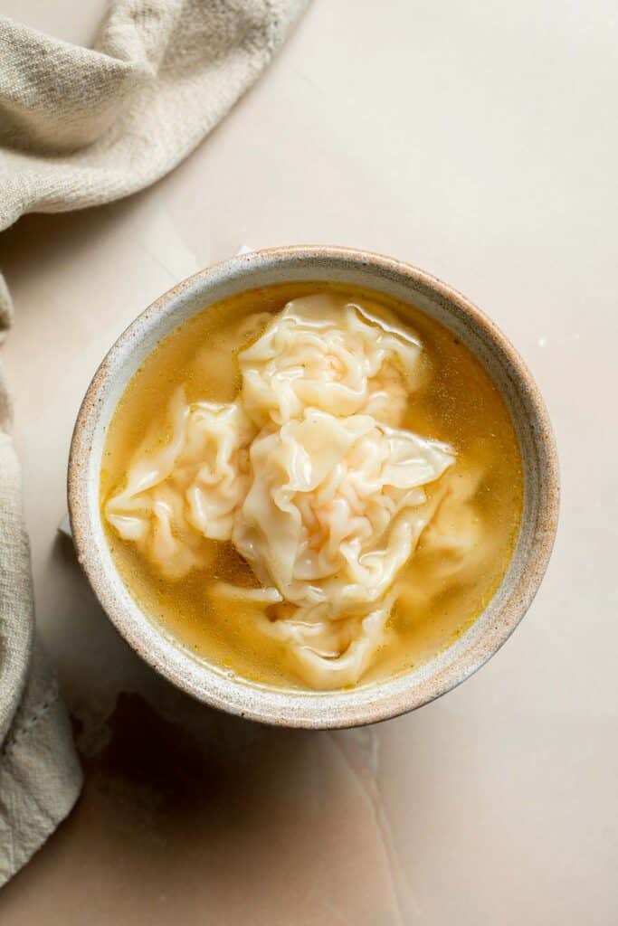 Easy 10-minute Wonton Soup is filling, delicious, and flavorful. With just a handful of simple ingredients, this homemade soup is ready in only 10 minutes! | aheadofthyme.com