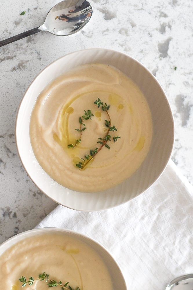 A handful of ingredients and a few simple steps makes creamy cauliflower and garlic soup one of the easiest and tastiest soups ever. | aheadofthyme.com