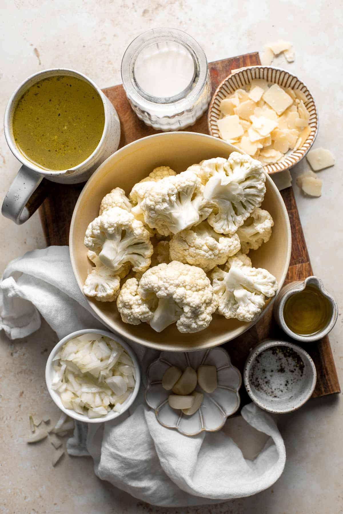 Creamy Garlic Cauliflower Soup is creamy and healthy. This vegetarian soup is ready in 45 minutes with a handful of wholesome ingredients and a few steps. | aheadofthyme.com