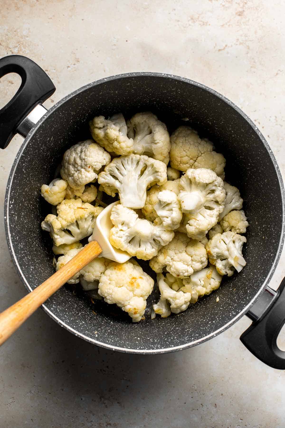 Creamy Garlic Cauliflower Soup is creamy and healthy. This vegetarian soup is ready in 45 minutes with a handful of wholesome ingredients and a few steps. | aheadofthyme.com