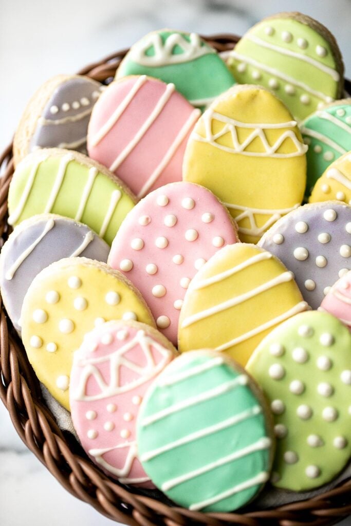 Cute, delicious, and easy-to-make Easter egg sugar cookies with royal icing are the perfect treat to make this Easter. Crisp outside and soft inside. | aheadofthyme.com