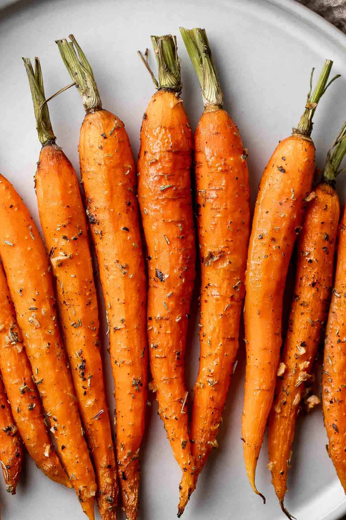 Garlic and herb roasted carrots are delicious and flavorful, easy to make, and the perfect vegan Easter side dish — or for any time of the year! | aheadofthyme.com