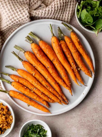 Garlic and herb roasted carrots are delicious and flavorful, easy to make, and the perfect vegan Easter side dish — or for any time of the year! | aheadofthyme.com